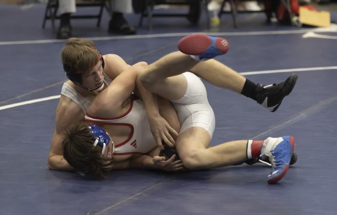 Elgin’s Gabe Dittmeyer (top) controls his match against a Collinsville grappler in the semifinal round last Saturday at Enid. Dittmeyer won his match 8-5 and earned three team points. HUGH SCOTT JR. | SOUTHWEST CHRONICLE