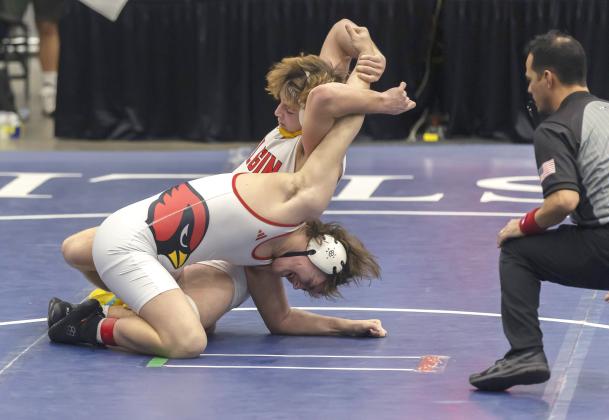 Elgin freshman Ritson Meyer stretches the arm of his Collinsville opponent during the 190-pound match in the semifinal round of the Dual State Championships last Saturday. Ritson pinned his opponent at 1:01 of the third period. HUGH SCOTT JR. | SOUTHWEST CHRONICLE