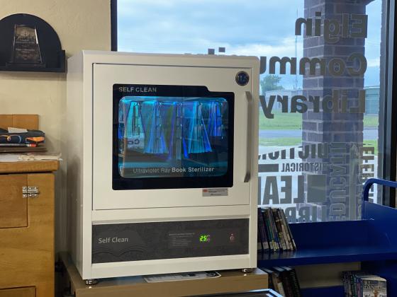 Of the more than 12,000 books at the Elgin Community Library, approximately 300 of them have gone through the book sterilizer. Elgin is the first library in the state to own the $4,900 device. The sterilizer was made possible through ARPA funds via the City of Elgin. Photo by Curtis Awbrey