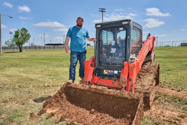 Lonnie Johnson gets ready to use some equipment to work on the drainage ditch. Wichita Dirt Work works primarily on both commercial and residential projects in the Elgin/Fletcher/Sterling area. PHOTOS BY CHRIS MARTIN