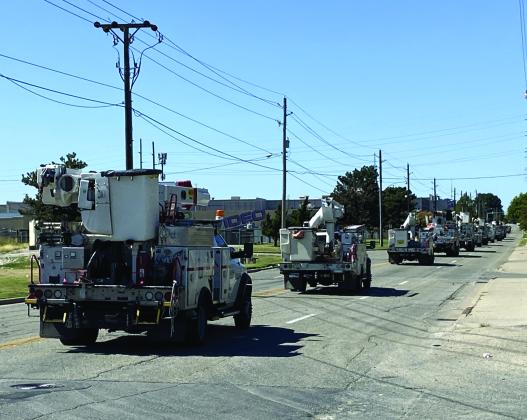 A caravan of Public Service Co. of Oklahoma utility trucks pulls out of a Tulsa facility Sept. 26 en route to Florida; crews also departed from Lawton and McAlester. The utility company sent 150 employees and business associates to Florida to help restore electric power disrupted by Hurricane Ian.  LEDGER PHOTO COURTESY WAYNE GREENE