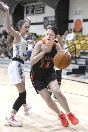 Sterling’s Ashlyn Clift dribbles past a Fletcher defender along the baseline during Tuesday’s 57-16 win. Sterling is now 10-3 for the season. HUGH SCOTT JR. | SOUTHWEST CHRONICLE