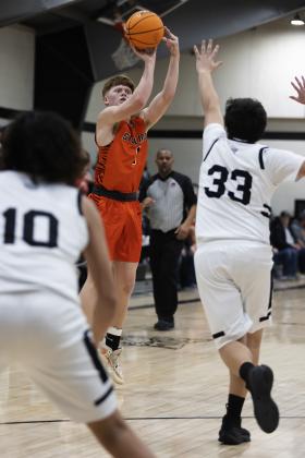 Sterling senior Hayden Taliaferro shoots over the hands of a Fletcher defender in a recent game. Taliaferro and teammate Max Puccio were named to the All-Tournament team at last week’s Black Diamond Tournament in Rush Springs. Sterling finished second. HUGH SCOTT JR. | SOUTHWEST CHRONICLE