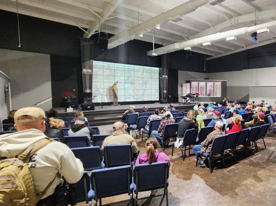 An Oklahoma Highway Patrol Community Response Team member briefs volunteers and law enforcement officials during an extensive, coordinated grid search of Cyril Wednesday at Family Life Church in Cyril. STEVE BOOKER | SOUTHWEST CHRONICLE