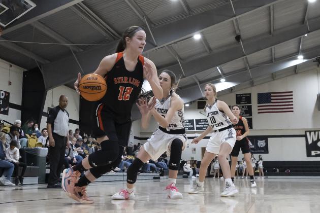 Sterling’s Ava Alexander dribbles up court against Fletcher Tuesday night. Alexander finished with 10 points. HUGH SCOTT JR. | SOUTHWEST CHRONICLE