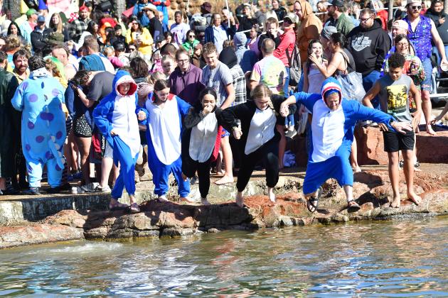 About 200 people braved the not-quite-freezing water of Bath Lake last Saturday to take part in Medicine Park’s annual Polar Plunge. STEVE BOOKER | SOUTHWEST CHRONICLE