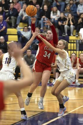 Freshman post player Danika Pendley passes the ball to a teammate despite being swarmed by Community Christian defenders. HUGH SCOTT JR. | SOUTHWEST CHRONICLE