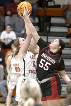 Sterling’s Kinley Mansel (4) battles a Rush Springs player for the ball during a recent game. The Lady Tigers play in the Class A district tournament beginning Saturday at Velma-Alma. HUGH SCOTT JR. | SOUTHWEST CHRONICLE