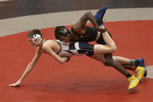 Brice Martin, top, slams El Reno’s Foxx Kurtz to the mat in the third-place match last Saturday during regional tournament action. Kurtz defeated Martin 5-2. However, Martin qualified for the state tournament with his fourth-place finish. HUGH SCOTT JR. | SOUTHWEST CHRONICLE
