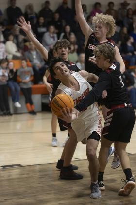 Sterling’s Max Puccio (4) tries to flip the ball toward the basket during a recent game against Rush Springs. Sterling played its first round regional tournament game Thursday against Union City. Results were not available at press time. HUGH SCOTT JR. | SOUTHWEST CHRONICLE
