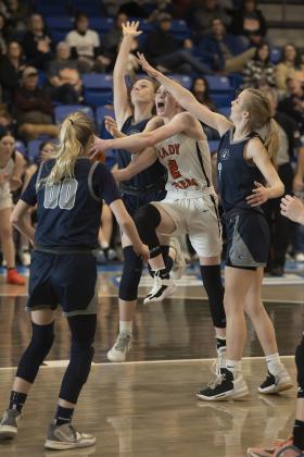 Sterling’s Emma Nunley drives to the basket while surrounded by three Cordell defenders during first-round action at the Class A regional tournament last week. Sterling won three regional games and advanced to the Area Tournament. HUGH SCOTT JR. | SOUTHWEST CHRONICLE