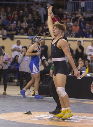 Ritson Meyer is proclaimed the champion of the 190-pound weight class during last week’s state meet. HUGH SCOTT JR. | SOUTHWEST CHRONICLE