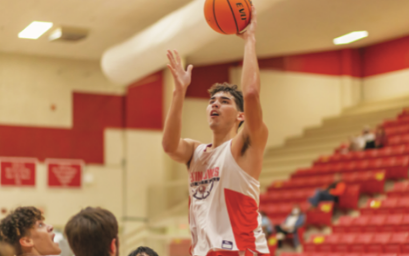 RISING UP: Jayden Parker rises above the crowd during Elgin’s scrimmage Carnegie on Nov. 14, 2020.
