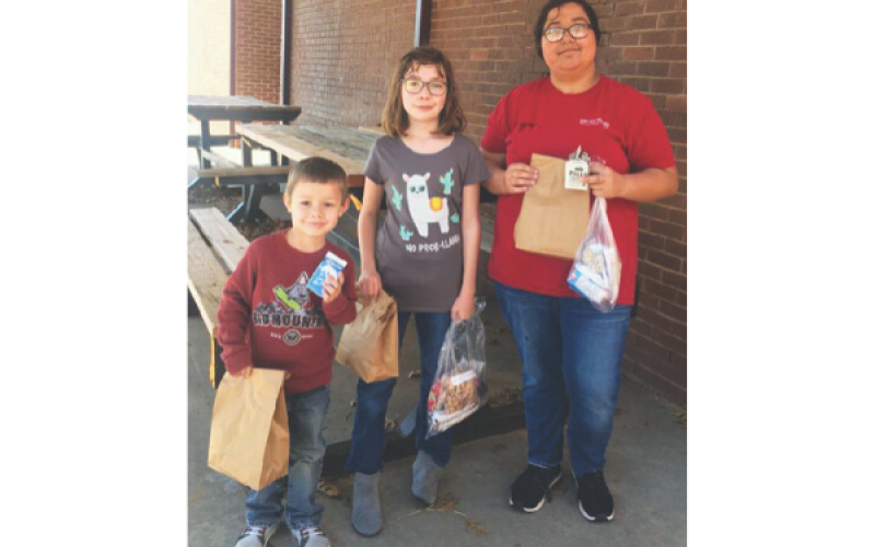 Qualified to provide meals to students during the recent closures due to COVID-19, Fletcher Public Schools has been handing out to-go sack lunches for kids in the district. On Tuesday, March 24, FPS senior Lauren Givens, Leila Kerrick, fifth grade, and Matthew Givens, Pre-K, walked to the school to retrieve their sack lunch.