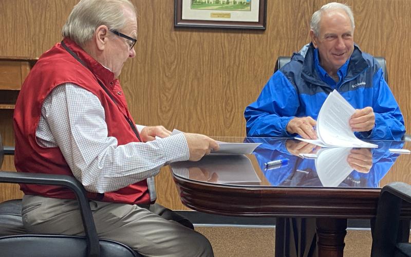 From the left, Comanche County Commissioners Johnny Owens and Gail Turner review documents during a commission meeting Monday at the Comanche County Courthouse. The commission took care of housekeeping matters, including forms for county employees who received premium pay under the American Rescue Plan Act.  Eric Swanson/Staff photo