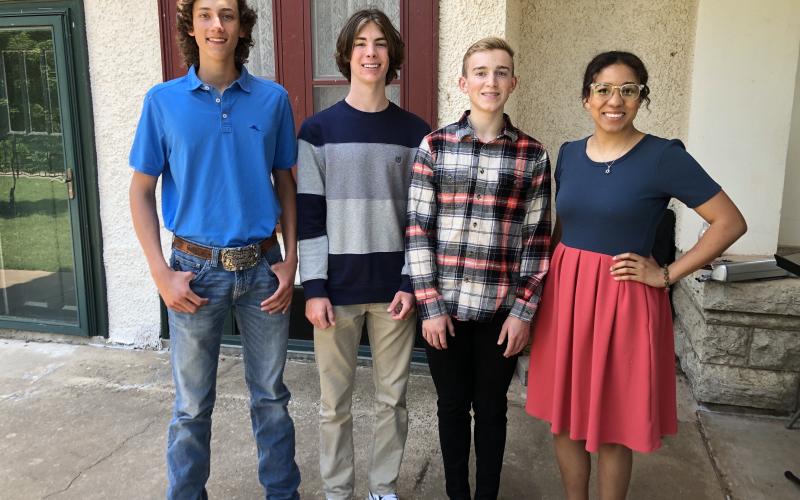 From left are essay contestants Chase Pickett (2nd place), Gideon Gish (1st place), Ben Schulke (3rd place) and Ashley Chapman, vice president of The Red Cord. Pickett and Gish are homeschooled students from Lawton and Schulke will be a senior at Elgin High School.  Photo by Tim Farley