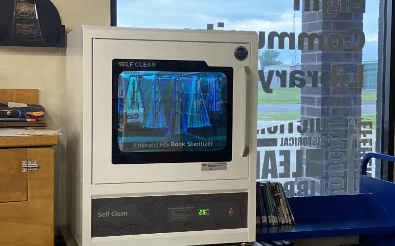 Of the more than 12,000 books at the Elgin Community Library, approximately 300 of them have gone through the book sterilizer. Elgin is the first library in the state to own the $4,900 device. The sterilizer was made possible through ARPA funds via the City of Elgin. Photo by Curtis Awbrey