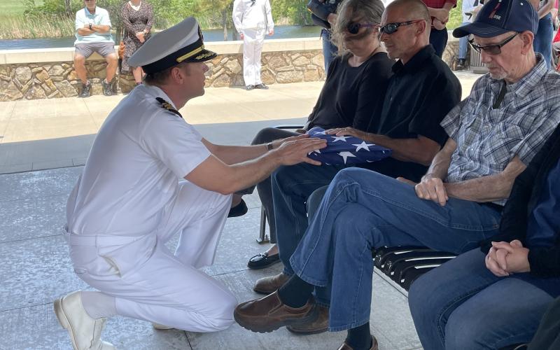 Jeremy Sarratt, longtime family friend accepts a flag for Seaman Kenneth McAbee.SW Chronicle photos by Bekah Fountain-Kobayashi