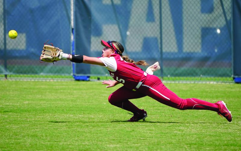 Oklahoma’s Taylon Snow dives for a ball hit for a double by Oklahoma State’s Kiley Naomi in the third inning of the NCAA Big 12 Championship Saturday, May 14, 2022, in Oklahoma City.  AP Photo/Sue OgrockiOklahoma’s Taylon Snow dives for a ball hit for a double by Oklahoma State’s Kiley Naomi in the third inning of the NCAA Big 12 Championship Saturday, May 14, 2022, in Oklahoma City.  AP Photo/Sue Ogrocki