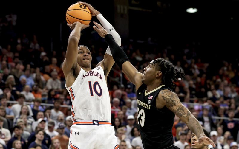 FILE - Auburn forward Jabari Smith (10) shoots a 3-pointer over Vanderbilt guard Jamaine Mann (23) during the second half of an NCAA college basketball game Feb. 16, 2022, in Auburn, Ala. Smith is one of the top forwards in the upcoming NBA draft. (AP Photo/Butch Dill, File)