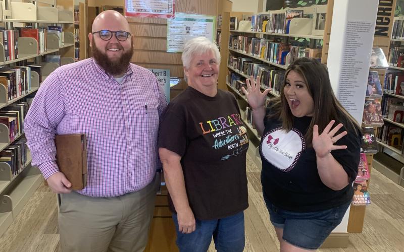 : Elgin Chamber of Commerce officials meet at the Elgin Community Library to finalize plans for the city’s first Family Fall Festival. From left are Jesse Belvin, treasurer; Leslie Durham, president; and Kayley Sandy, vice president. Photo by Tori White