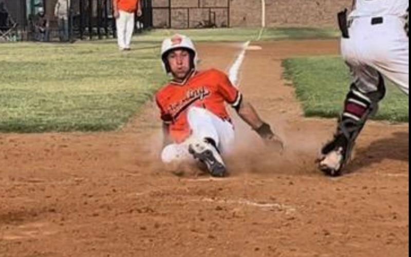 Sterling’s Nate Anderson slides home for one of the Tigers’ four runs in the season opening loss to Granite. Photos by Tania Huitt