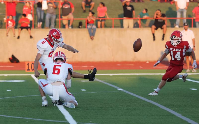 Elgin kicker Gabe Dittmeyer kicks one of his three extra points against Cache. Photo by Hugh Scott Jr.