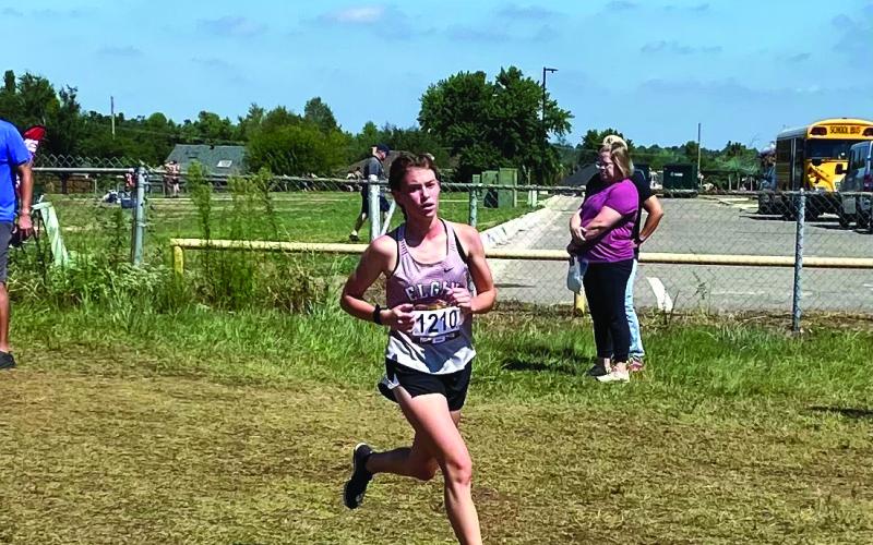 Elgin junior runner Audrey McElhaney wins her second cross-country meet of the season with a first place showing in the elite division of the Carl Albert Invitational on Friday, Sept. 2. Photo by Rick McElhaney