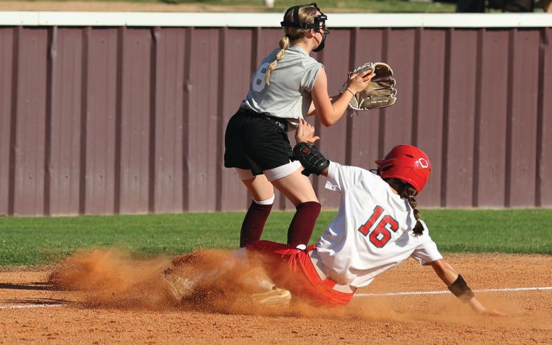 Elgin’s Jaemie Johns (16) slides into third on a triple during Tuesday’s game against Blanchard. Elgin lost, 8-6. Photo by Hugh Scott Jr.