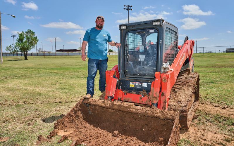 Lonnie Johnson gets ready to use some equipment to work on the drainage ditch. Wichita Dirt Work works primarily on both commercial and residential projects in the Elgin/Fletcher/Sterling area. PHOTOS BY CHRIS MARTIN