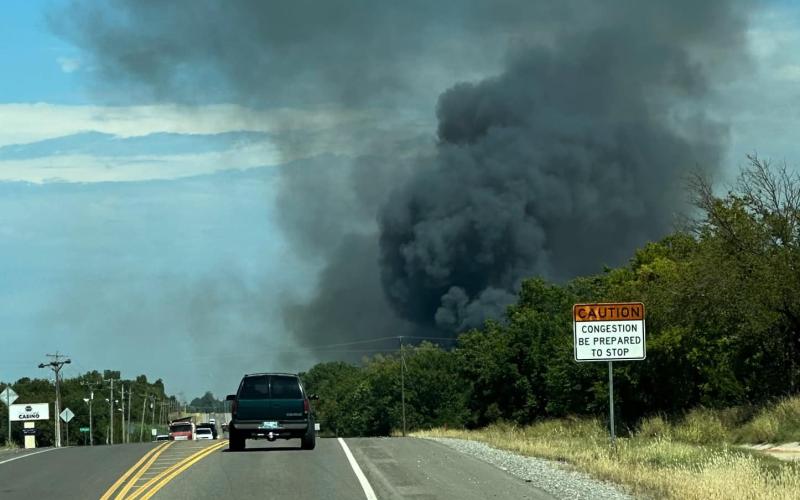 Fire trucks are shown at the scene of a grass fire that broke out Saturday afternoon on Little Bear Loop, east of U.S. Highway 62. Three vacant mobile homes were destroyed in the blaze. Photo courtesy of Comanche County-Lawton Emergency Manaagement