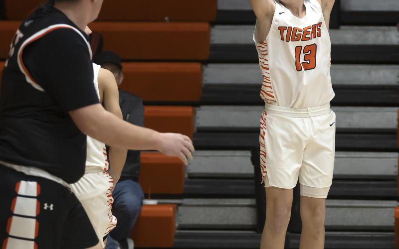 Hugh Scott Jr. | Southwest Chronicle Riley Lile (13) shoots from the outside as an Apache defender looks on during the Dec. 16 matchup.
