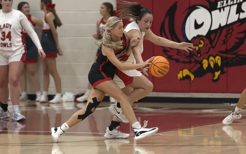 Hugh Scott Jr. | Southwest Chronicle Lady Owl junior Addy Choate battles for the ball with a Duncan player during the Dec. 13 come-from-behind 57-54 win. Elgin defeated Western Conference foe Newcastle 43-24 on Dec. 16.