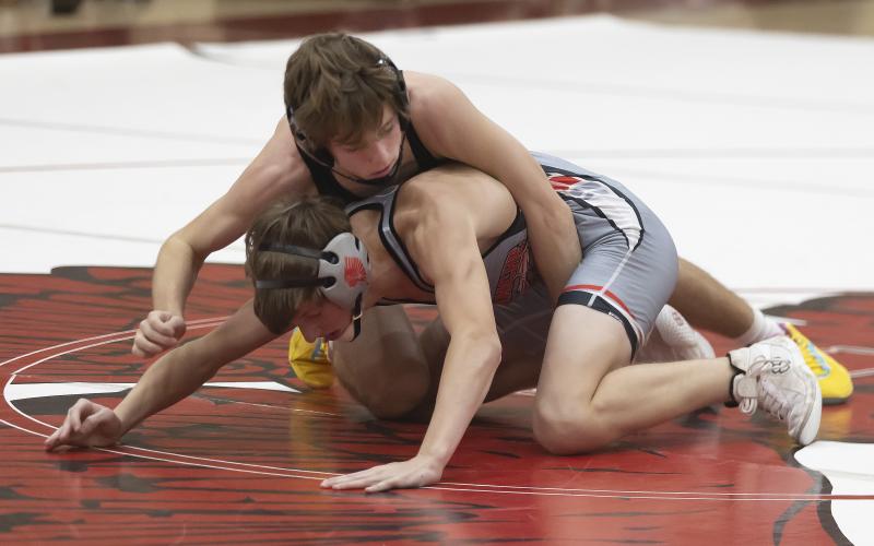 Elgin’s Hunter Jackson controls his Comanche opponent during the first match of the season. Jackson won the 120-pound championship at the Blanchard Tournament last weekend. PHOTO BY HUGH SCOTT JR.