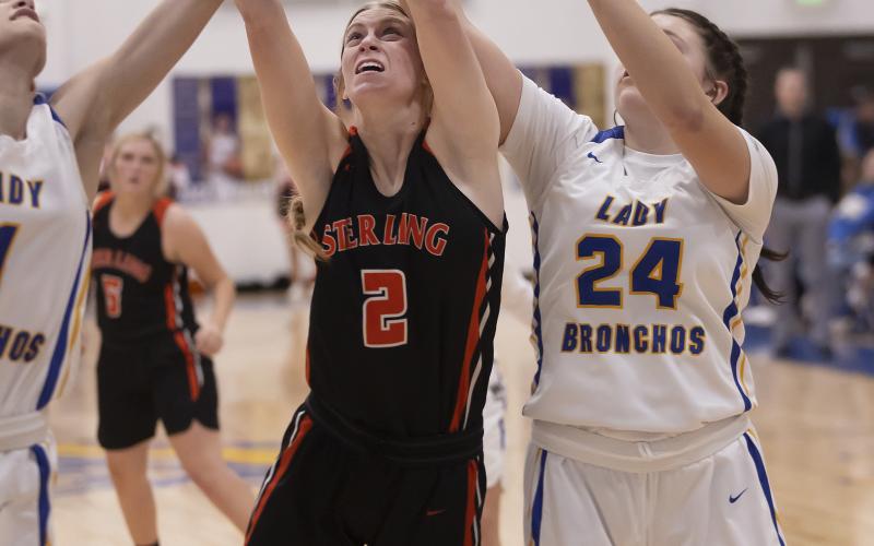Sterling’s Emma Nunley (2) battles for a rebound during Tuesday’s 55-22 win over Central High. PHOTO BY HUGH SCOTT JR.
