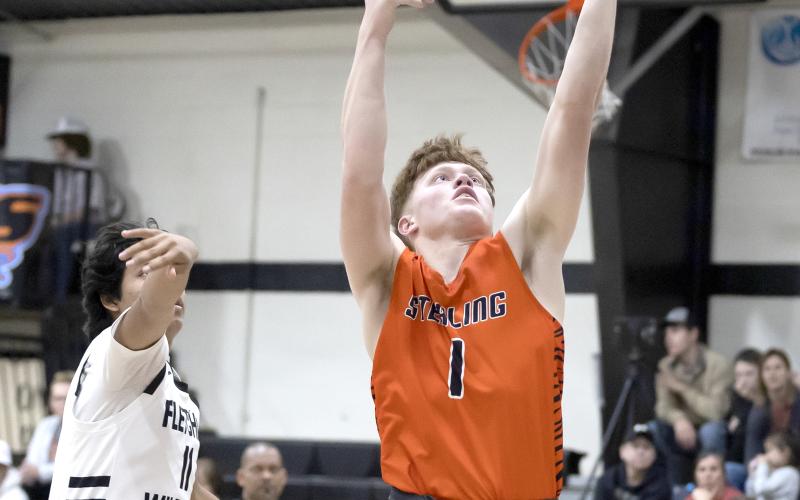 Sterling senior Hayden Taliaferro scores two of his game-high 22 points Tuesday night against Fletcher. The 54-25 win improved Sterling’s record to 7-6 heading into this week’s Black Diamond Tournament at Rush Springs. HUGH SCOTT JR. | SOUTHWEST CHRONICLE