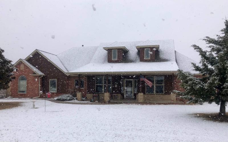 Below, Snow forms a blanket over a local property in Elgin. CATHY SAGMO PARKS