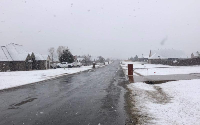 In this photo, snow covers much of the ground in this Elgin neighborhood. CATHY SAGMO PARKS