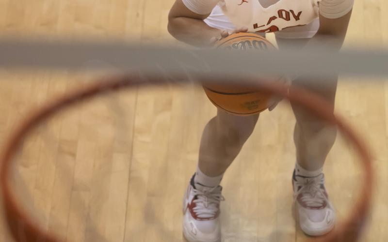 Elgin freshman Kelby Carter eyes the basket during a free throw attempt during the consolation championship game at last week’s Weatherford Classic. Elgin defeated McGuinness to claim the consolation title matchup. HUGH SCOTT JR. | SOUTHWEST CHRONICLE