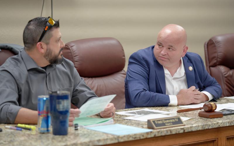 From the left, Elgin City Councilman Fred Guevara and Mayor JJ Francais discuss agenda items during the council’s Feb. 16 meeting. The council voted 4-0 to create the position of events director. CHRISTOPHER BRYAN | SOUTHWEST CHRONICLE