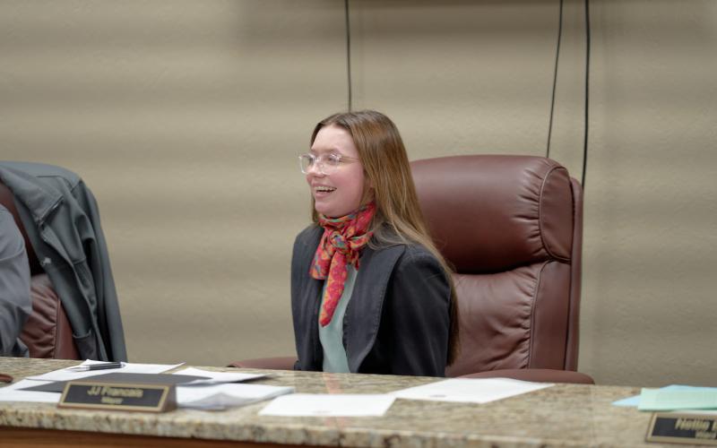 From the mayor’s seat, Elgin Middle School eighth-grader Josie Chandler reads her essay aloud during Elgin’s City Council meeting. Chandler’s essay focused on priority issues of public safety, sense of community and economic development. She wants to create a comprehensive crime prevention and emergency response system, a community action plan and work toward creating local incentives to encourage business growth. CHRISTOPHER BRYAN