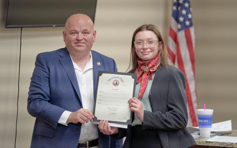 From the left, Elgin Mayor JJ Francais congratulates Elgin Middle School eighth-grader Josie Chandler, who was presented with a mayoral citation during an Elgin City Council meeting Feb. 16 for her third-place win in OML’s “If I Were Mayor” essay contest. CHRISTOPHER BRYAN