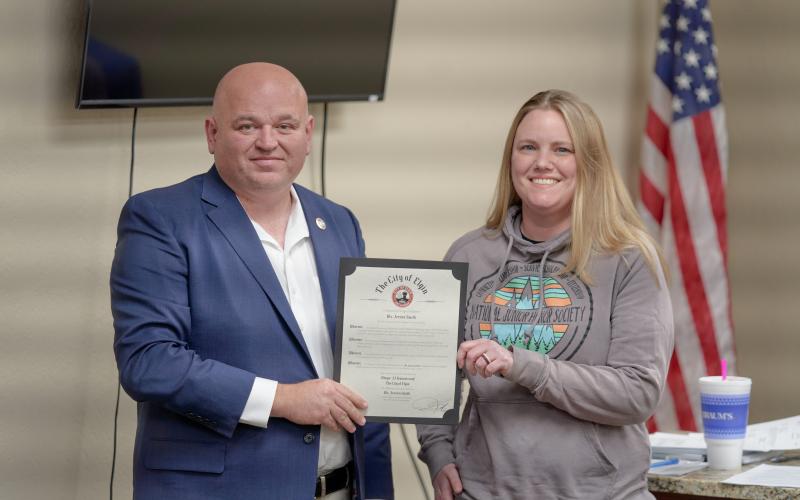 Elgin Mayor JJ Francais congratulates Elgin Middle School Teacher Jessica Smith, who was presented with a mayoral citation during an Elgin City Council meeting Feb. 16 for her work promoting civic engagement among Elgin students. CHRISTOPHER BRYAN