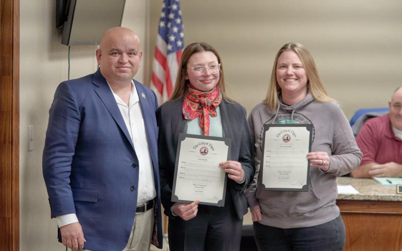 From the left, Elgin Mayor JJ Francais presents Elgin Middle School eighth-grader Josie Chandler, and Elgin Middle School Teacher Jessica Smith with mayoral citations during a Feb. 16 Elgin City Council meeting. CHRISTOPHER BRYAN