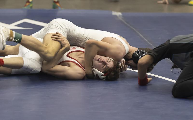 Elgin’s Austin Elam works to pin his Collinsville opponent during Saturday’s semifinal match at 138 pounds. Elam won by injury default during the second period. HUGH SCOTT JR. | SOUTHWEST CHRONICLE