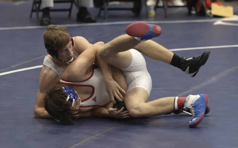 Elgin’s Gabe Dittmeyer (top) controls his match against a Collinsville grappler in the semifinal round last Saturday at Enid. Dittmeyer won his match 8-5 and earned three team points. HUGH SCOTT JR. | SOUTHWEST CHRONICLE