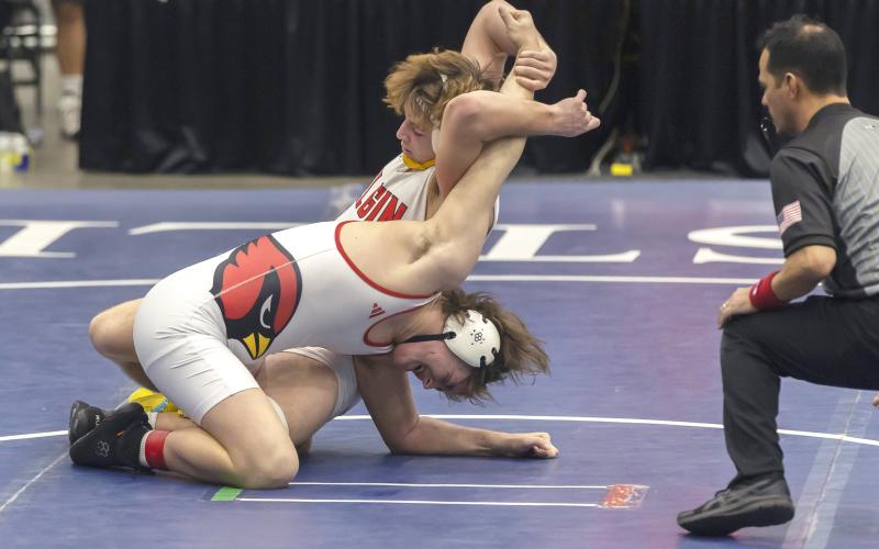 Elgin freshman Ritson Meyer stretches the arm of his Collinsville opponent during the 190-pound match in the semifinal round of the Dual State Championships last Saturday. Ritson pinned his opponent at 1:01 of the third period. HUGH SCOTT JR. | SOUTHWEST CHRONICLE