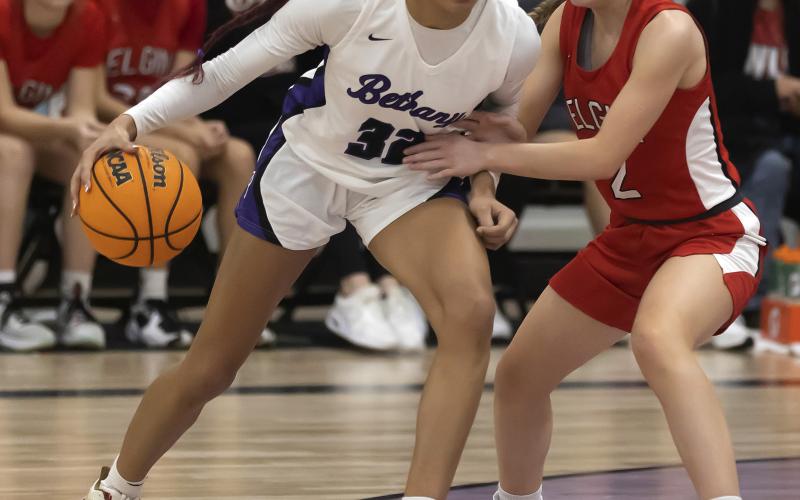 Lady Owl Kenley York guards a Bethany player during the Feb. 3 matchup. Bethany won the game, 64-29. Elgin broke a five-game losing streak Tuesday with a win over Chickasha. HUGH SCOTT JR. | SOUTHWEST CHRONICLE