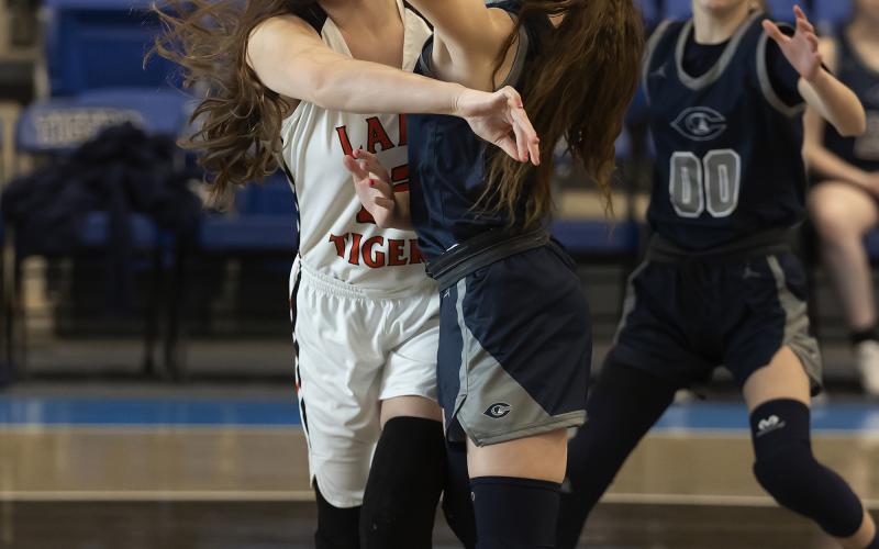 Ava Alexander (12) whips the ball to a Sterling teammate during regional tournament action last week. HUGH SCOTT JR. | SOUTHWEST CHRONICLE