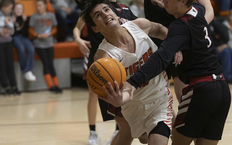 Sterling’s Max Puccio (4) tries to flip the ball toward the basket during a recent game against Rush Springs. Sterling played its first round regional tournament game Thursday against Union City. Results were not available at press time. HUGH SCOTT JR. | SOUTHWEST CHRONICLE